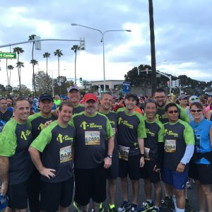 Jeff (center) with part of his team from OCRM at the start of the OC Half Marathon.